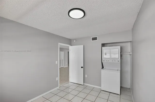 a view of a room with walk in closet and window