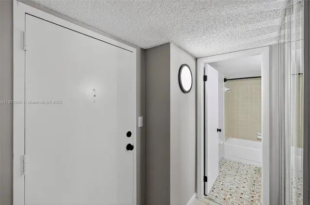 a view of a bathroom with wooden floor