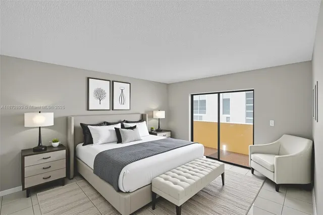 a bedroom with a bed and a couch