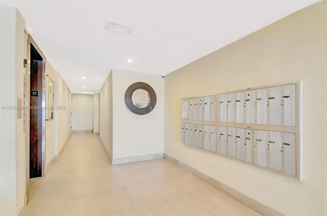 a living room with a couch and a potted plant