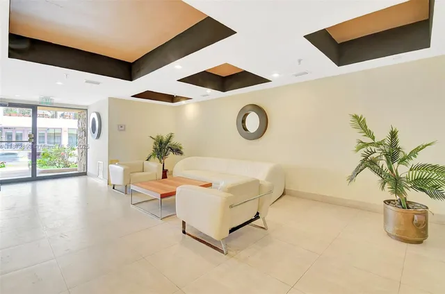 a view of a tall building next to a road