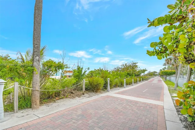 a view of a lake with boats and trees in the background