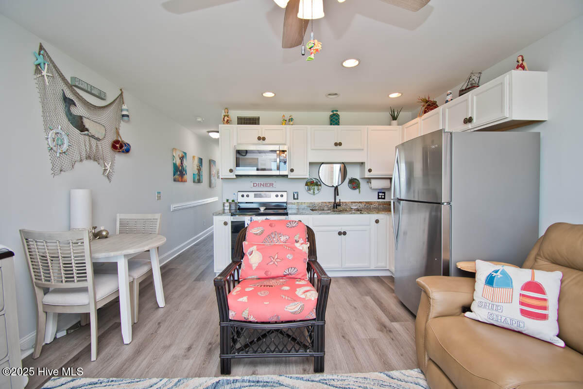 650 Cedar Point Boulevard, Unit A15 Cedar Point, NC 28584 - Photo 18 of 34 Living room to kitchen