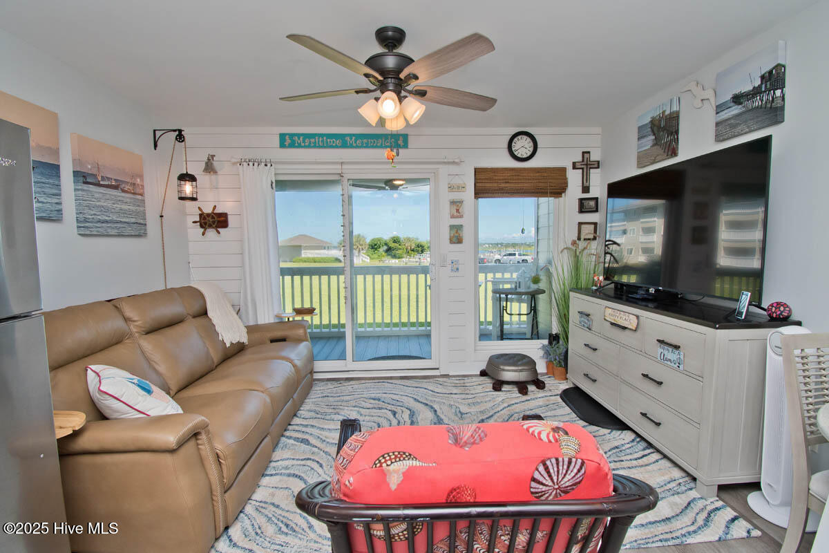 650 Cedar Point Boulevard, Unit A15 Cedar Point, NC 28584 - Photo 19 of 34 Living room to deck
