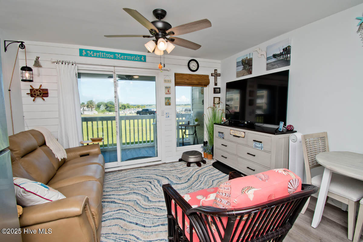 650 Cedar Point Boulevard, Unit A15 Cedar Point, NC 28584 - Photo 4 of 34 Living room to deck