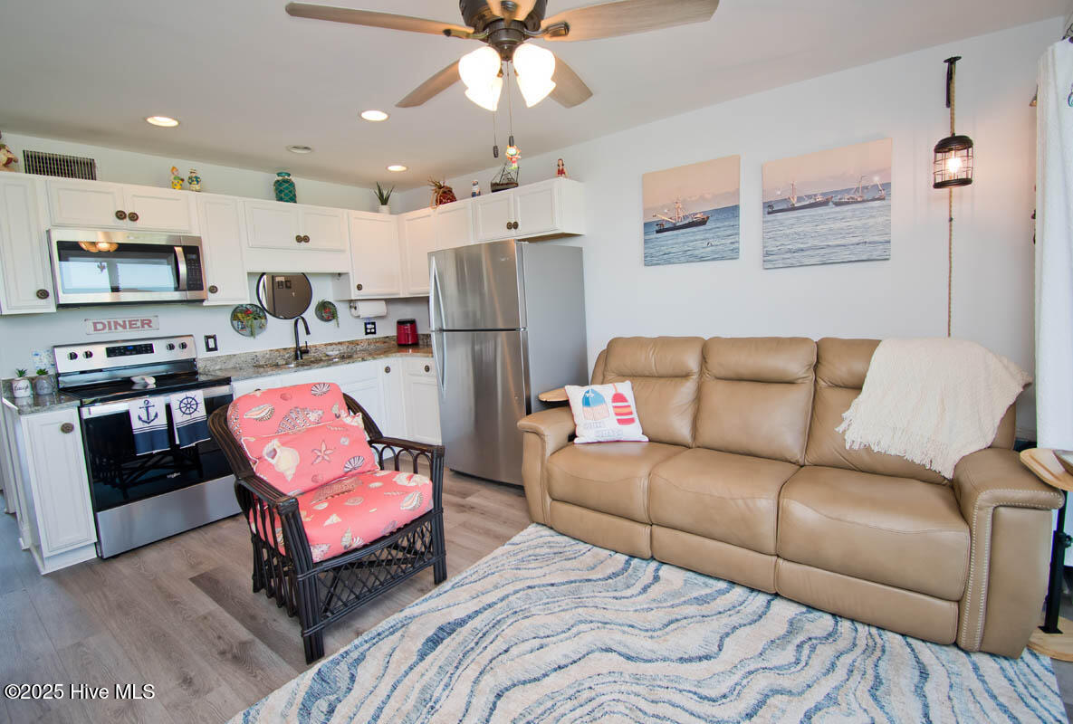 650 Cedar Point Boulevard, Unit A15 Cedar Point, NC 28584 - Photo 5 of 34 Comfortable sofa w/double reclinwes!
