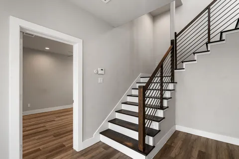a view of a kitchen with a sink and cabinets