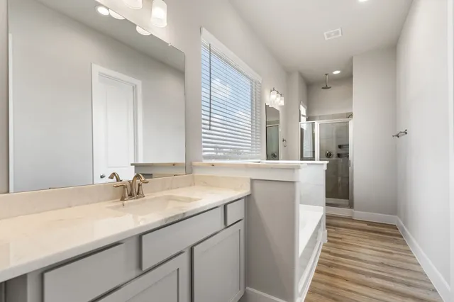 a bathroom with a bathtub and a shower