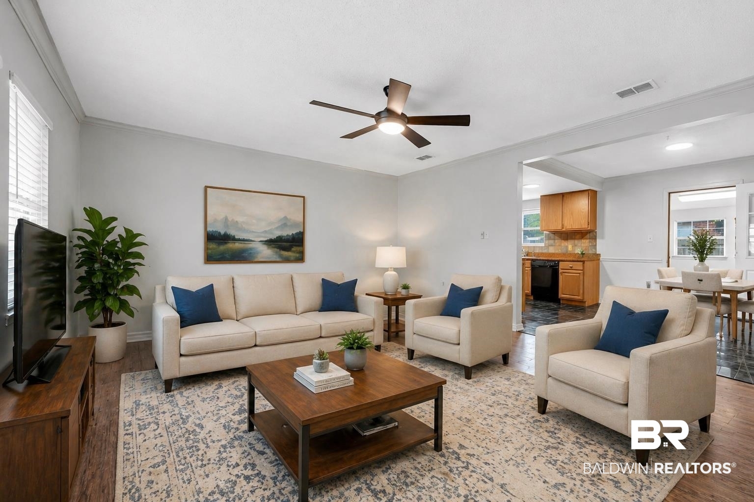 421 Cedar Court Foley, AL 36535 - Photo 10 of 39 Spacious living area featuring wood-finish flooring, a ceiling fan, and crown molding