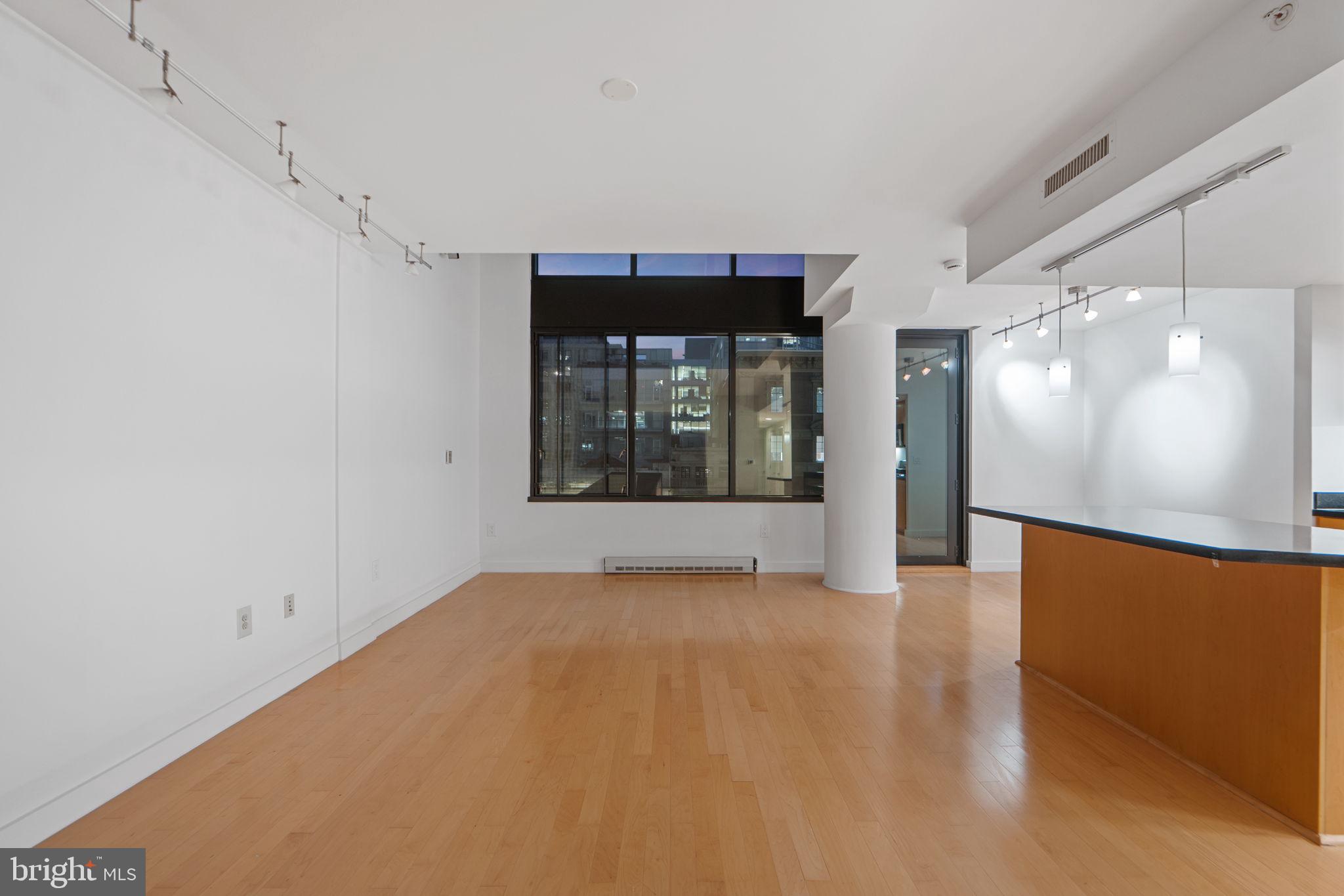 912 F Street Northwest, Unit 508 Washington, DC 20004 - Photo 18 of 40 a view of a hallway with a large window