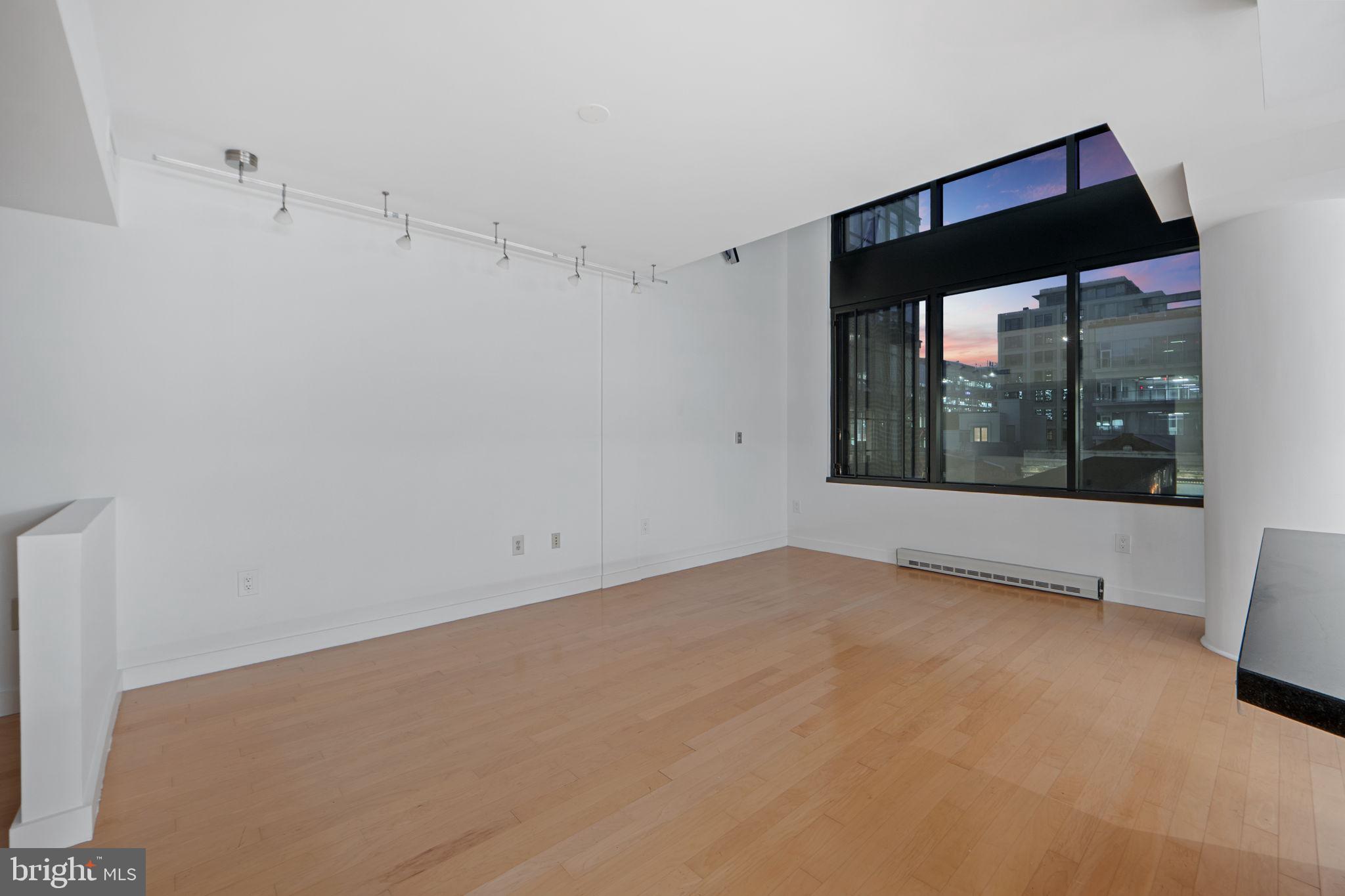 912 F Street Northwest, Unit 508 Washington, DC 20004 - Photo 20 of 40 a view of an empty room with a window