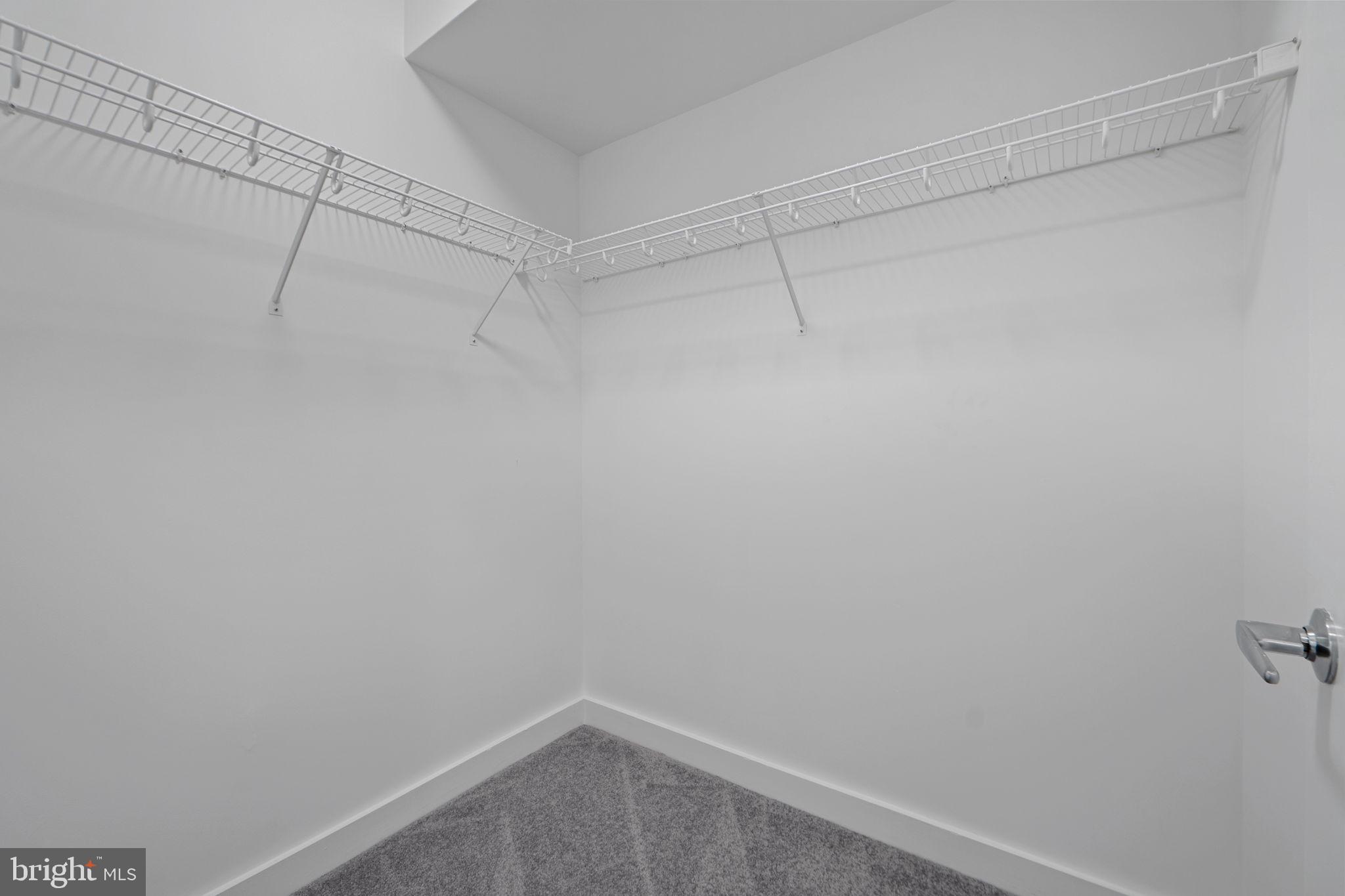 912 F Street Northwest, Unit 508 Washington, DC 20004 - Photo 32 of 40 a view of a room with racks on the wall