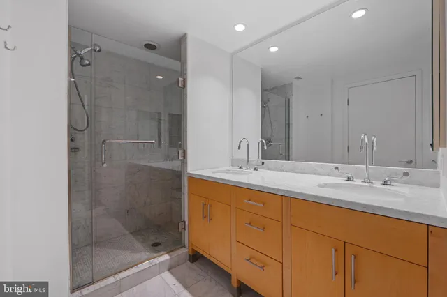 a view of a balcony with a couple of cars parked from a window