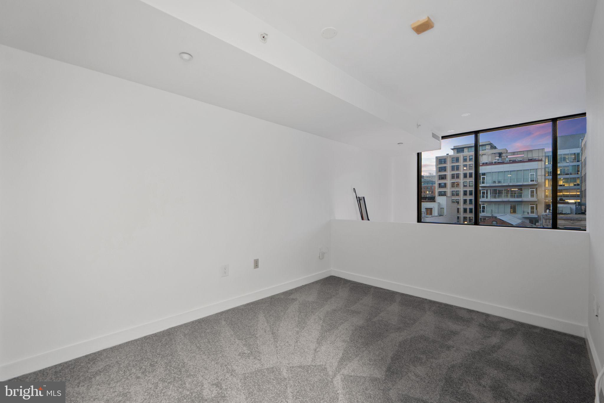 912 F Street Northwest, Unit 508 Washington, DC 20004 - Photo 37 of 40 a view of an empty room with a window
