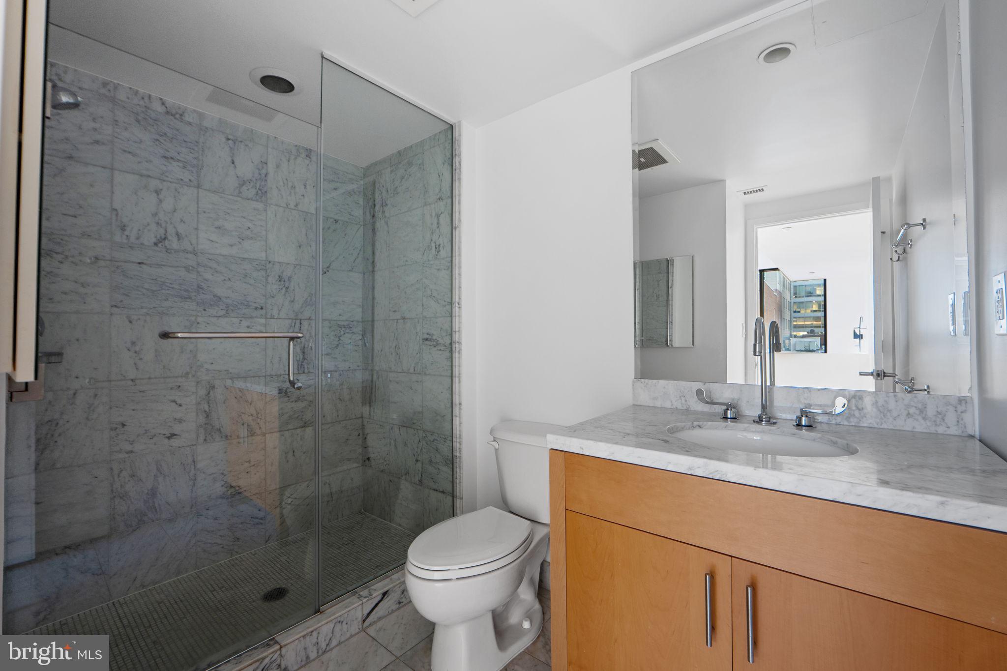 912 F Street Northwest, Unit 508 Washington, DC 20004 - Photo 40 of 40 a bathroom with a sink toilet and shower