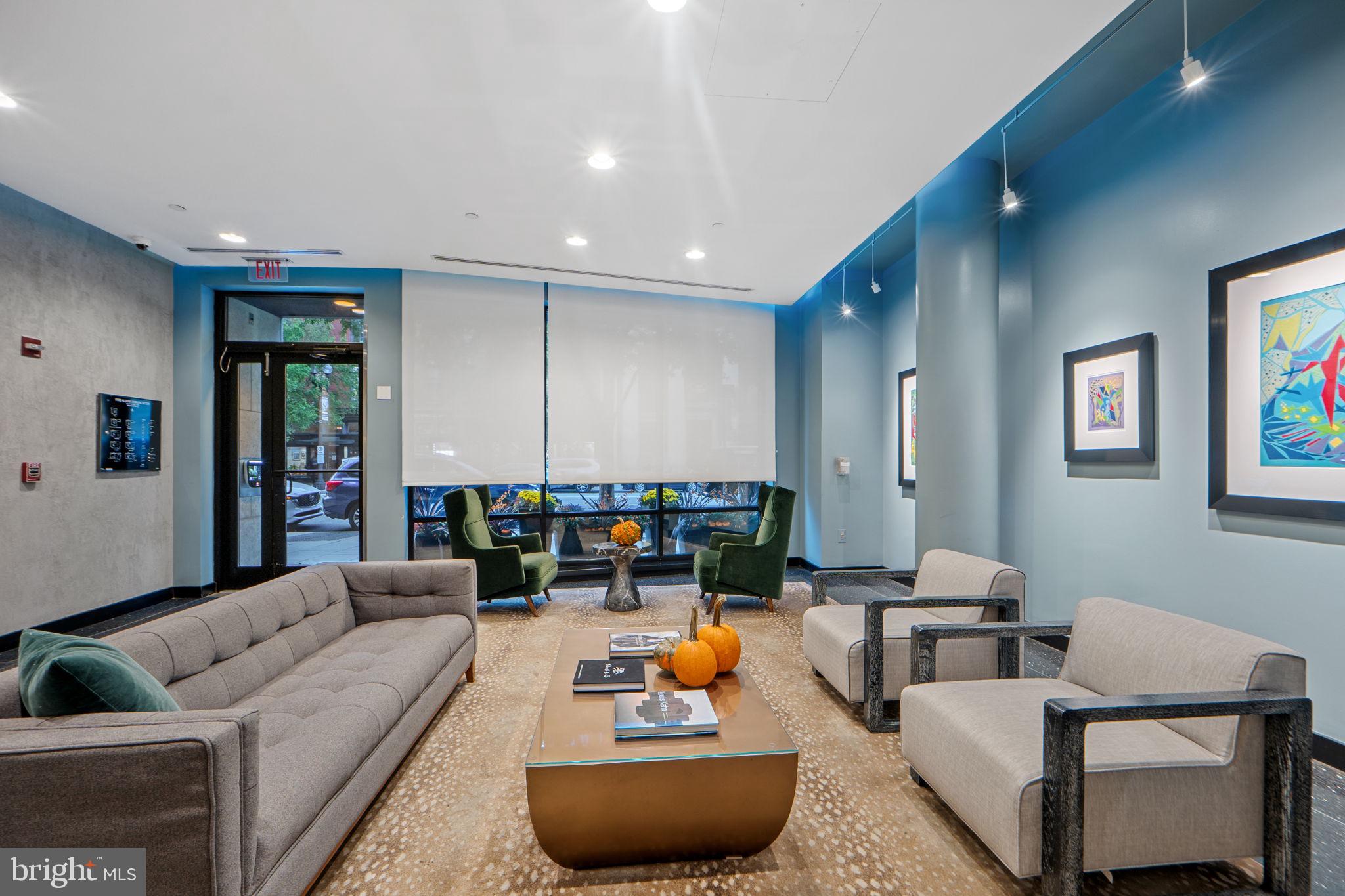 912 F Street Northwest, Unit 508 Washington, DC 20004 - Photo 7 of 40 a living room with furniture and a potted plant