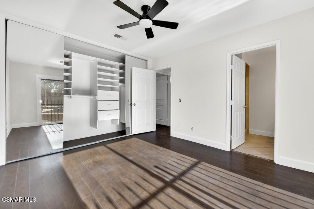 39202 Willowvale Road Palmdale, CA 93551 - Photo 17 of 36 a view of empty room with wooden floor and fan