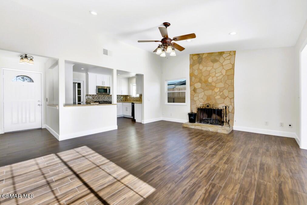 39202 Willowvale Road Palmdale, CA 93551 - Photo 2 of 36 a view of a livingroom with wooden floor and a ceiling fan