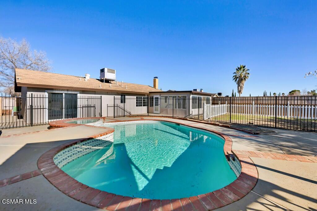 39202 Willowvale Road Palmdale, CA 93551 - Photo 25 of 36 a view of a house with swimming pool