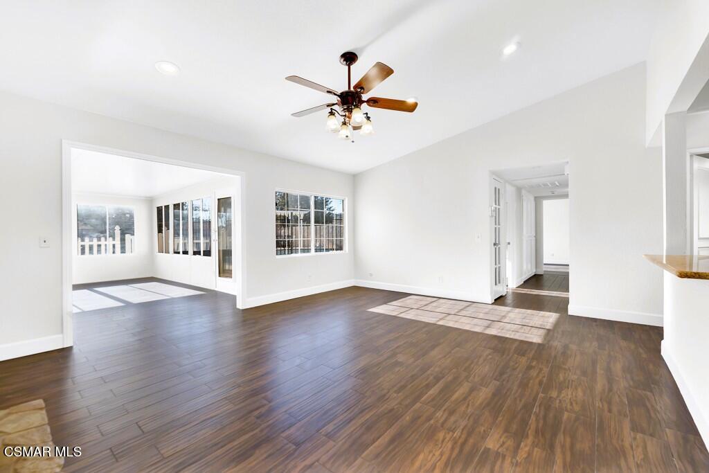 39202 Willowvale Road Palmdale, CA 93551 - Photo 4 of 36 a view of a livingroom with wooden floor and a ceiling fan