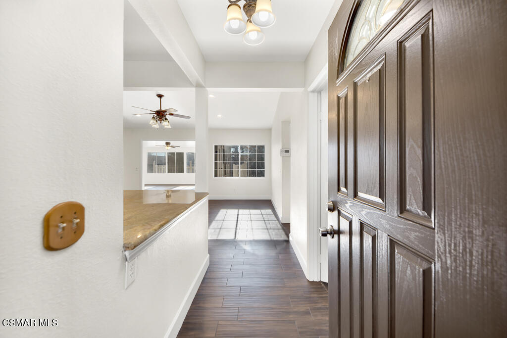 39202 Willowvale Road Palmdale, CA 93551 - Photo 8 of 36 a view of a hallway with windows and stairs
