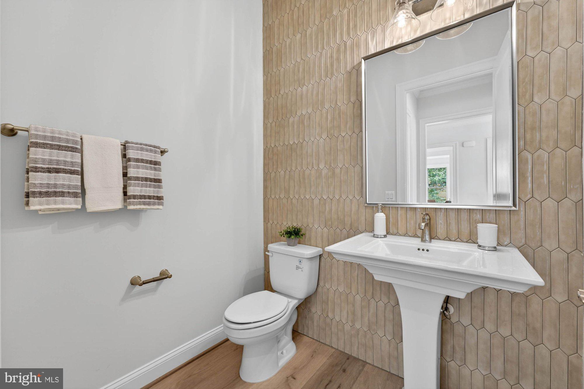 1436 Layman Street McLean, VA 22101 - Photo 16 of 105 a bathroom with a sink and a toilet