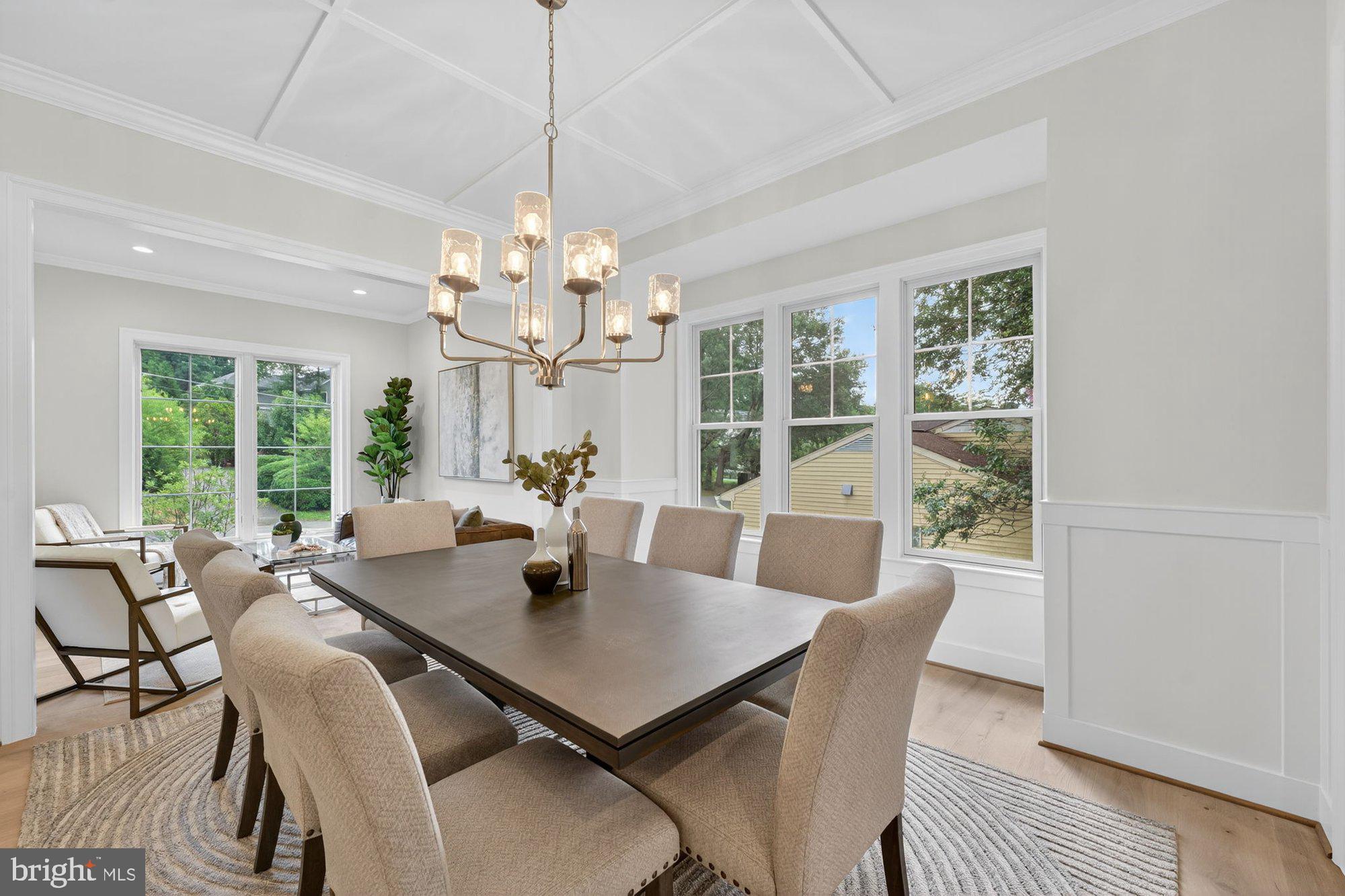 1436 Layman Street McLean, VA 22101 - Photo 18 of 105 a view of a dining room with furniture a chandelier and wooden floor
