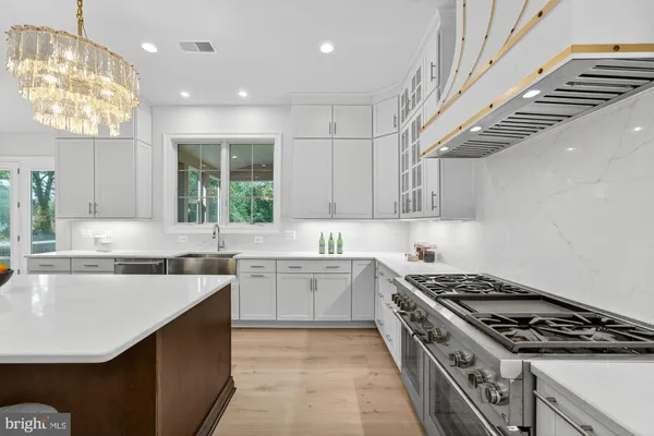 a view of a kitchen with washer and dryer