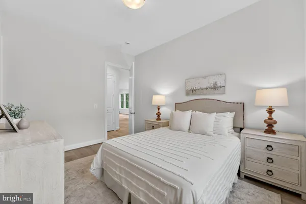 a big room with wooden floor and windows