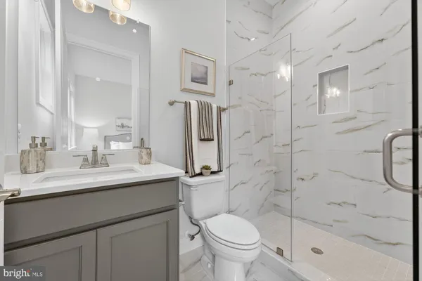 a view of a kitchen with a sink and wooden floor