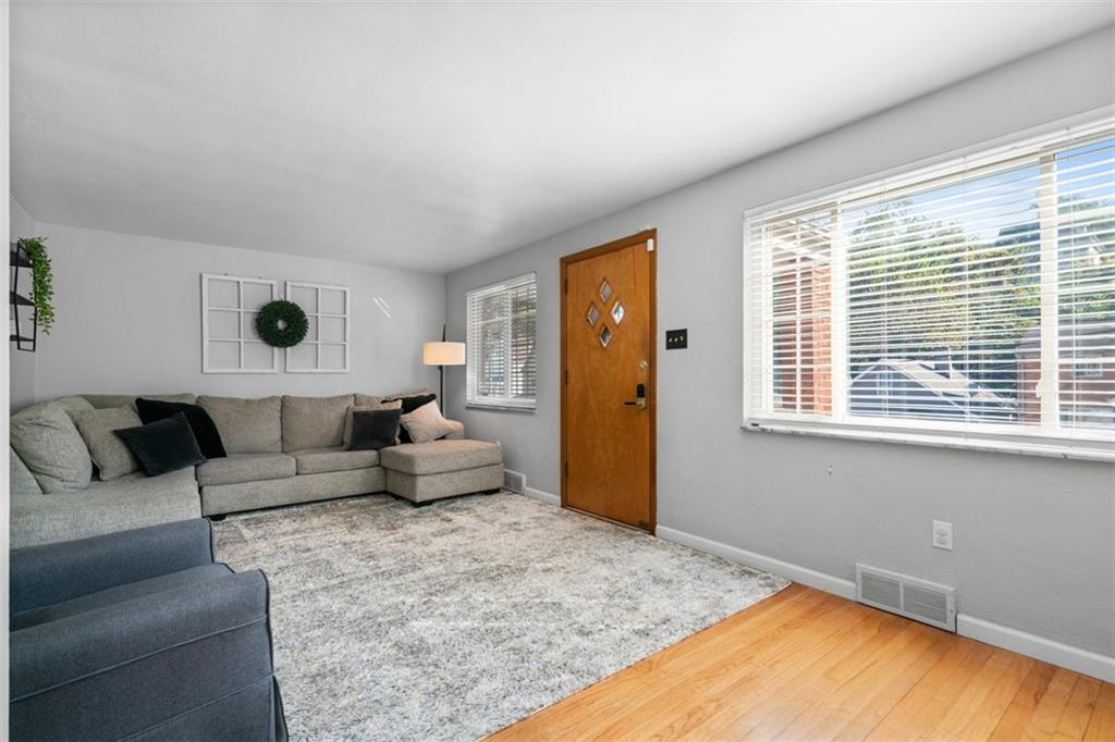1538 Rutherford Avenue Pittsburgh, PA 15216 - Photo 11 of 43 a living room with furniture and a flat screen tv