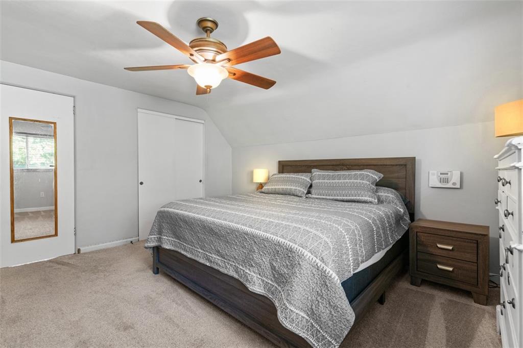 1538 Rutherford Avenue Pittsburgh, PA 15216 - Photo 19 of 43 a bedroom with a bed and a chandelier