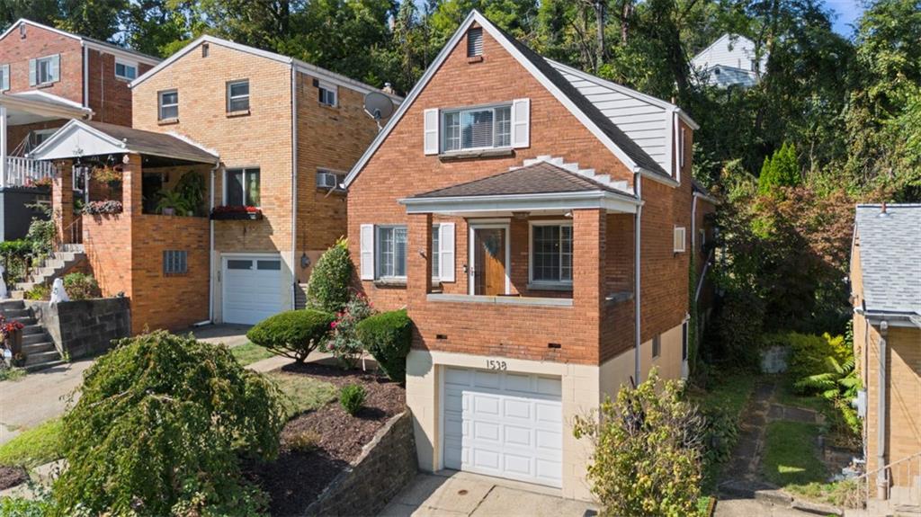 1538 Rutherford Avenue Pittsburgh, PA 15216 - Photo 2 of 43 a front view of a house with garden