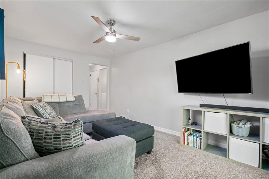 1538 Rutherford Avenue Pittsburgh, PA 15216 - Photo 28 of 43 a living room with furniture and a flat screen tv