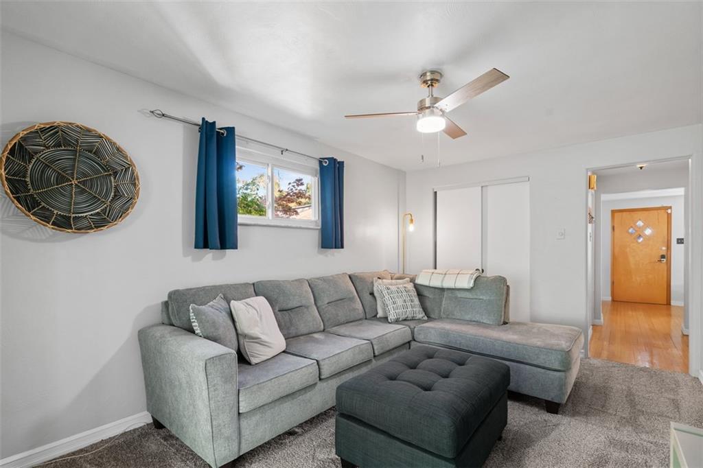 1538 Rutherford Avenue Pittsburgh, PA 15216 - Photo 29 of 43 a living room with furniture and a chandelier