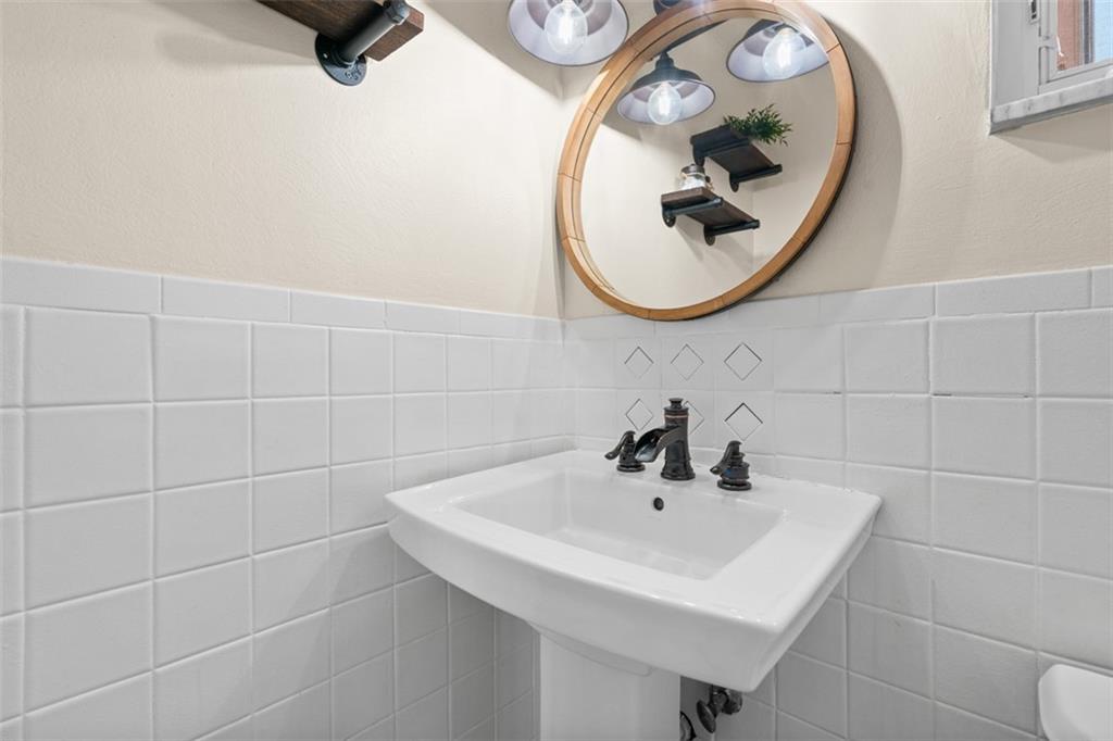 1538 Rutherford Avenue Pittsburgh, PA 15216 - Photo 30 of 43 a bathroom with a sink and a mirror