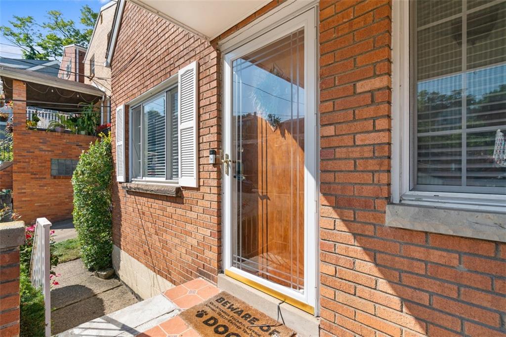 1538 Rutherford Avenue Pittsburgh, PA 15216 - Photo 7 of 43 a view of a brick house with a large windows