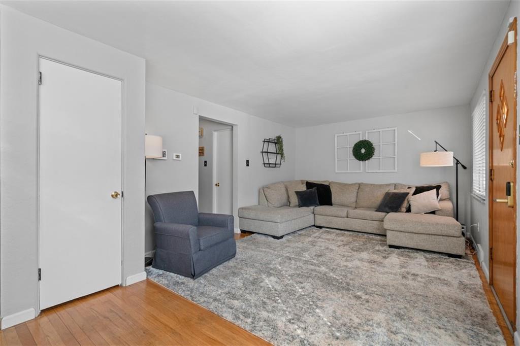 1538 Rutherford Avenue Pittsburgh, PA 15216 - Photo 9 of 43 a living room with furniture and a wooden floor