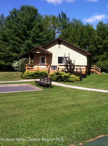 a view of a house with a big yard