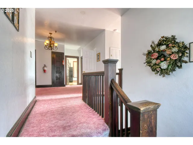a view of hallway with a kitchen