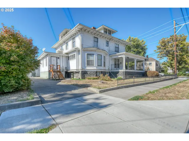 a front view of residential houses with yard