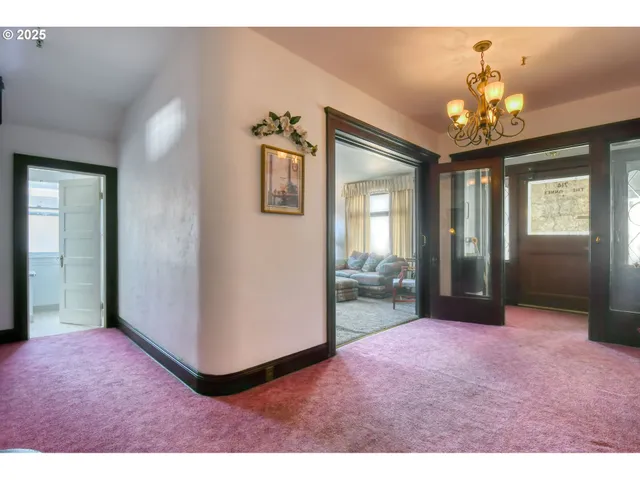 a bedroom with furniture and a wooden floor