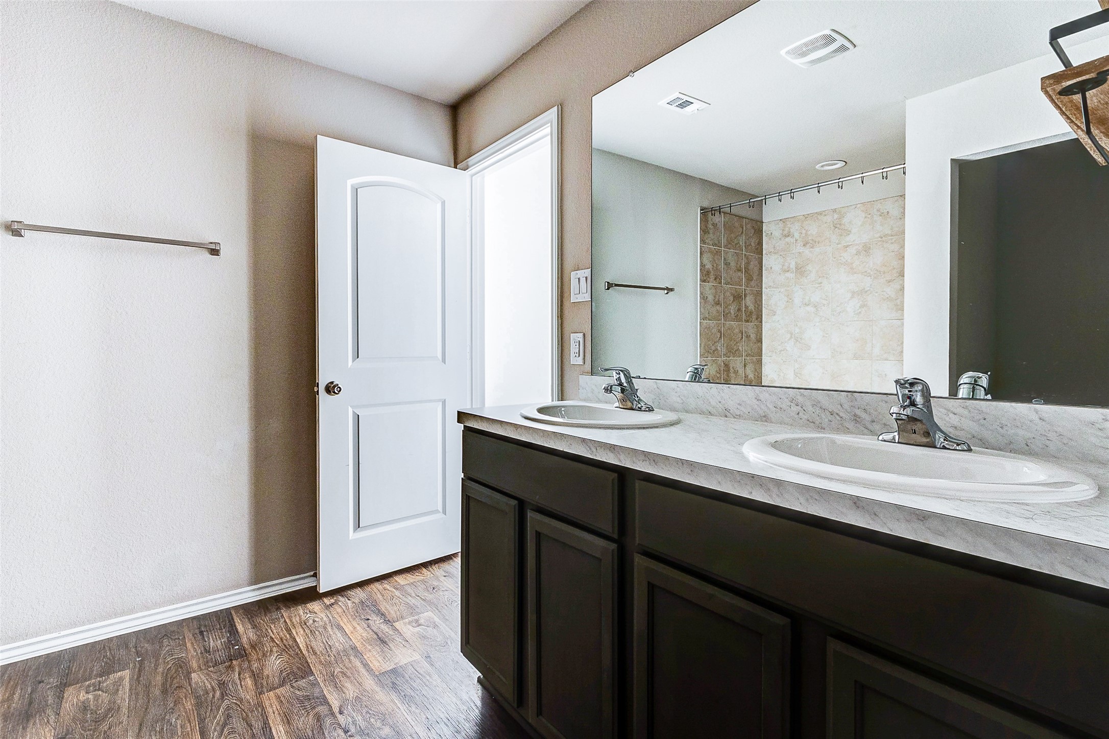 40454 Red Poppy Lane Magnolia, TX 77354 - Photo 12 of 23 a bathroom with a double vanity sink and mirror