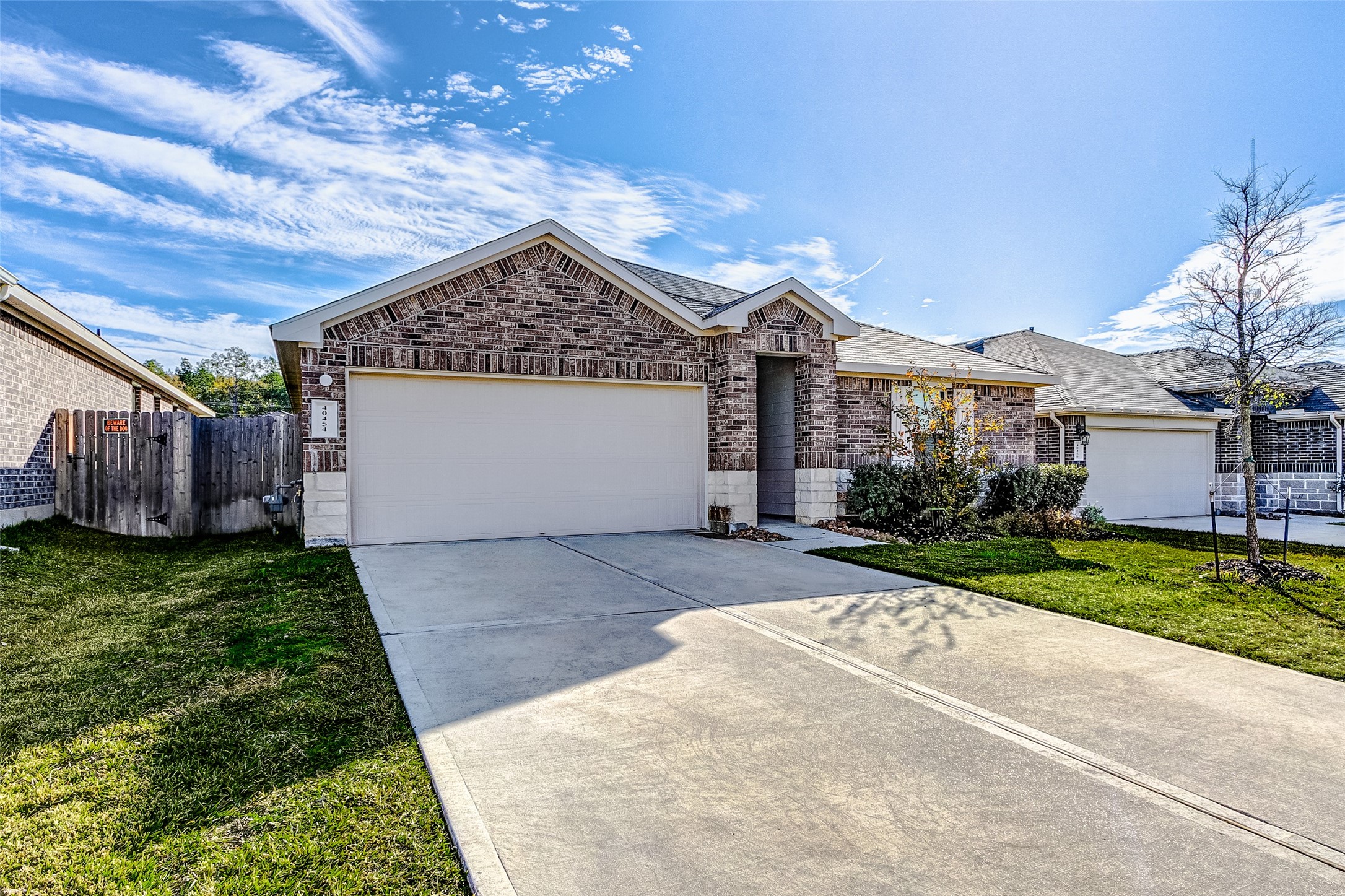 40454 Red Poppy Lane Magnolia, TX 77354 - Photo 2 of 23 a view of a house with a yard