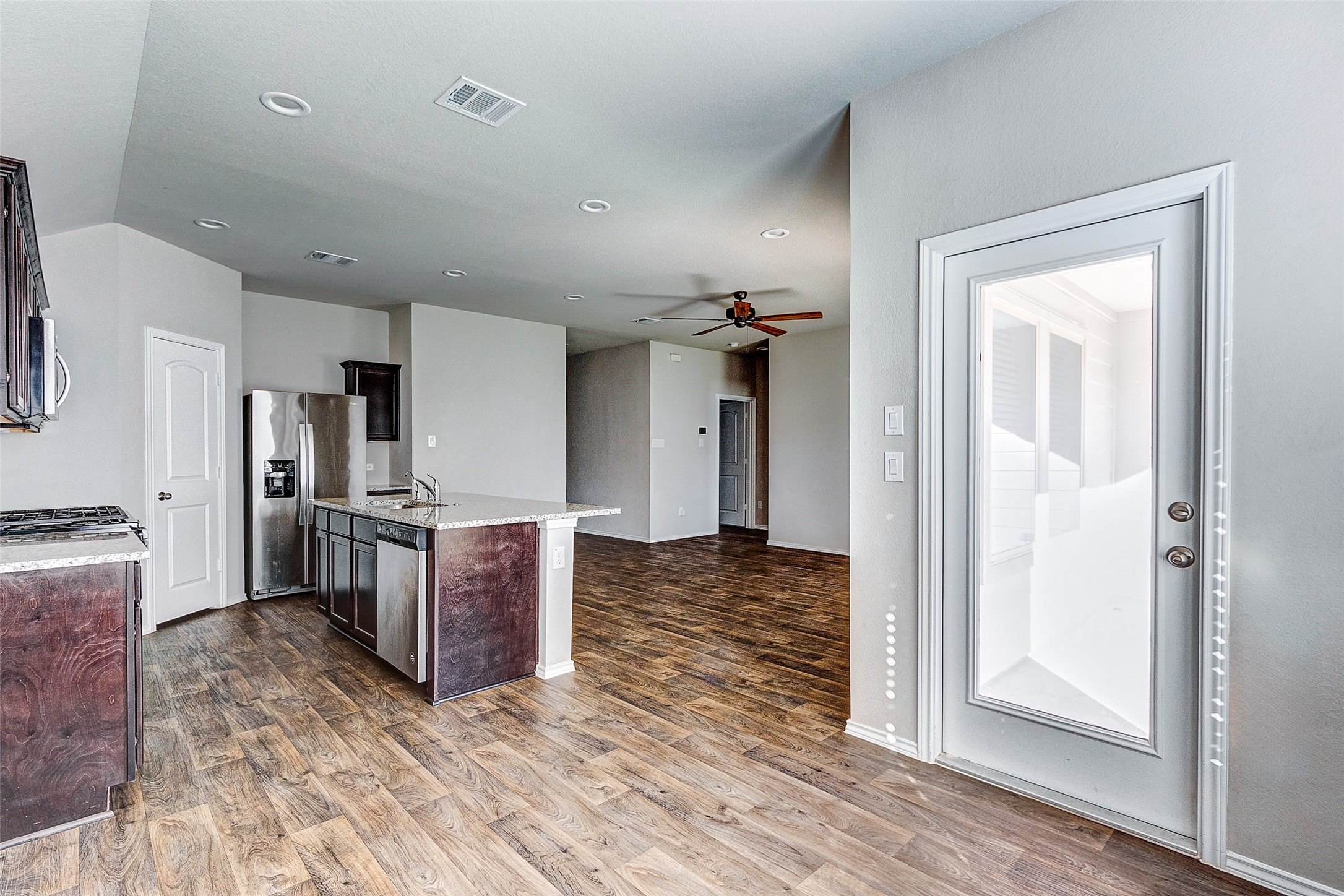 40454 Red Poppy Lane Magnolia, TX 77354 - Photo 9 of 23 a view of a kitchen and dining room