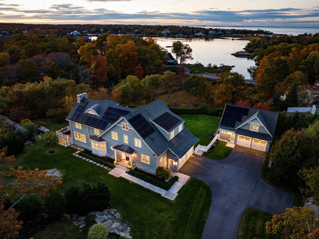 an aerial view of a house with garden space and street view