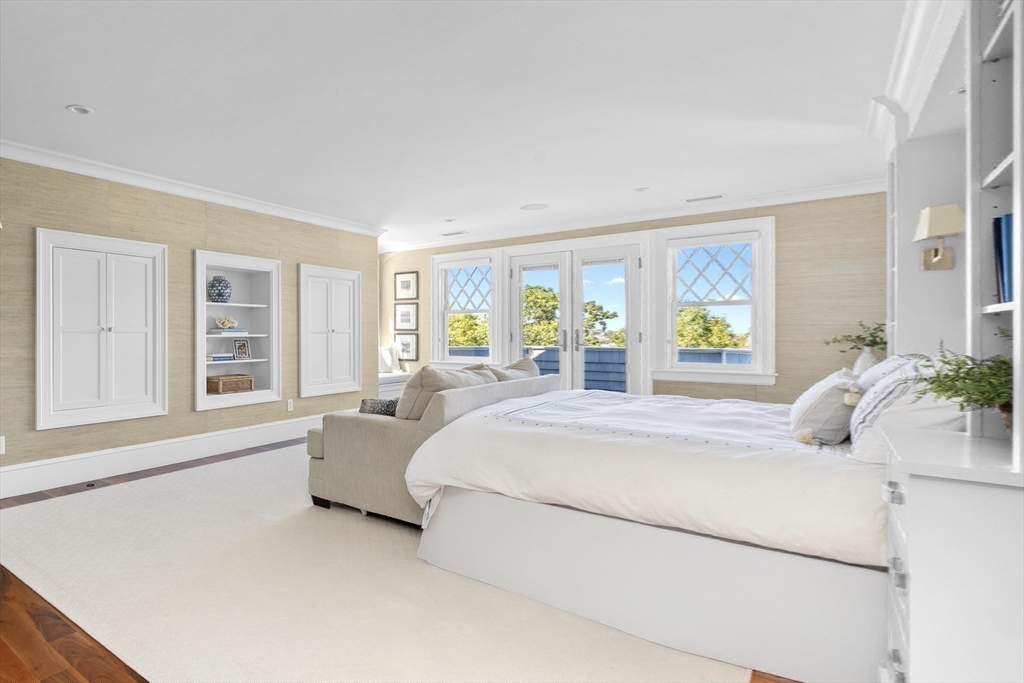 17 Mohawk Way Cohasset, MA 02025 - Photo 13 of 33 a spacious bedroom with a bed and a large window