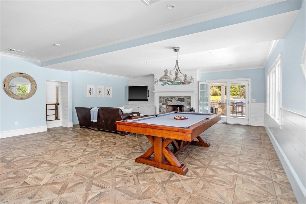 17 Mohawk Way Cohasset, MA 02025 - Photo 25 of 33 a living room with furniture a chandelier and a table
