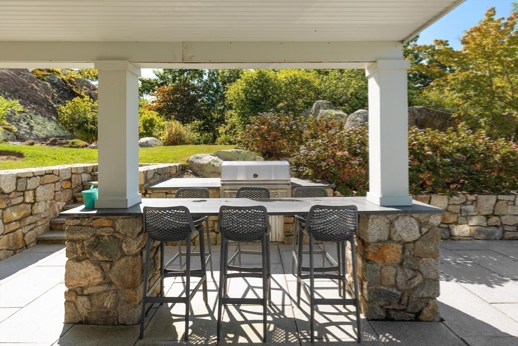 17 Mohawk Way Cohasset, MA 02025 - Photo 27 of 33 a view of an outdoor dining space with furniture