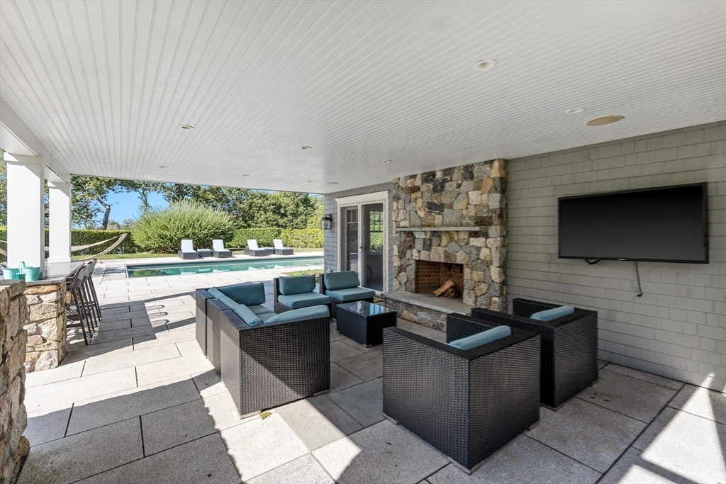 17 Mohawk Way Cohasset, MA 02025 - Photo 28 of 33 a living room with fireplace furniture and a flat screen tv